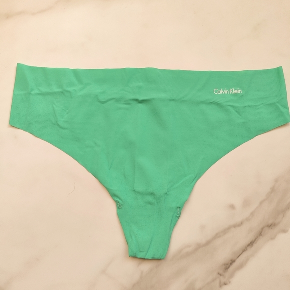NWOT CALVIN KLEIN INVISIBLES THONG PANTY IN AQUA GREEN SIZE SMALL - Picture 1 of 4